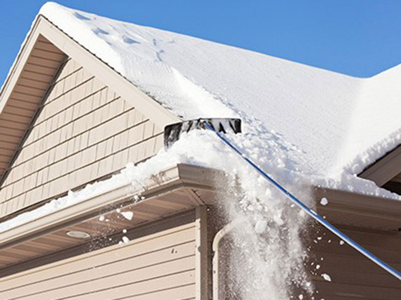 clearing snow from roof